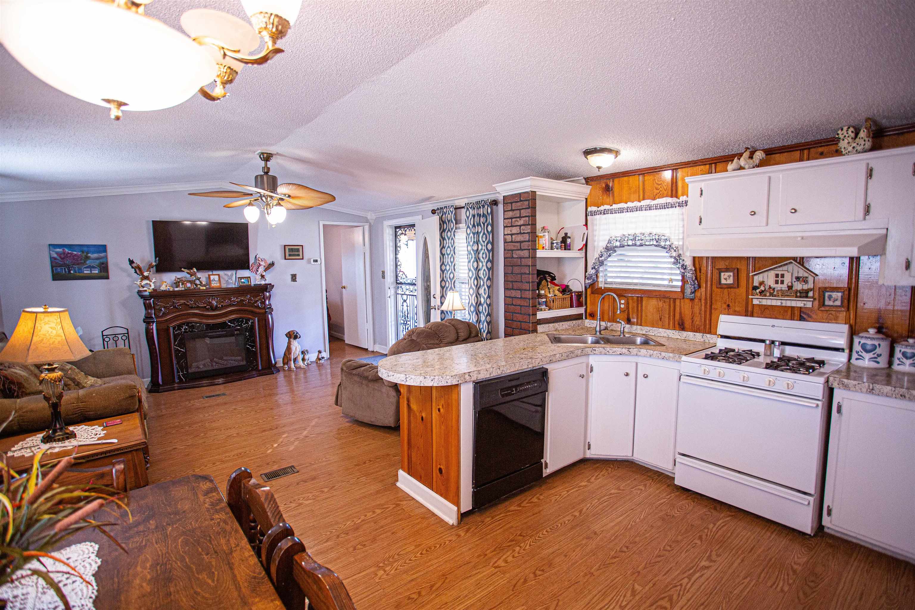 4100 Highway 209 Ripley, TN 38063 - Photo 5 of 36 a kitchen with stainless steel appliances a stove a sink and a refrigerator