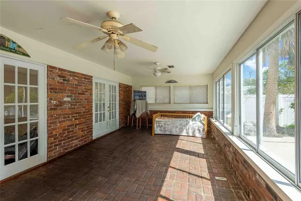 a view of a entryway with furniture and floor to ceiling window