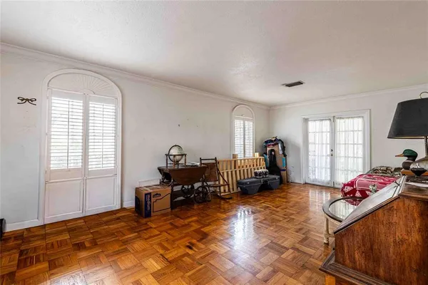 a bedroom with furniture and a window
