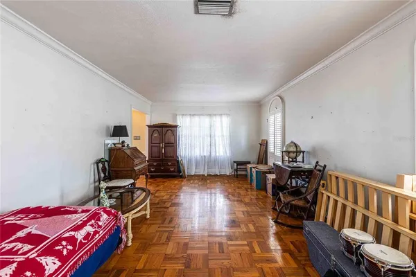 a bed room with a bed and a chair
