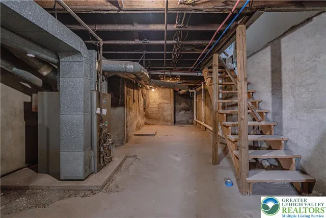 a view of an empty room with wooden walls