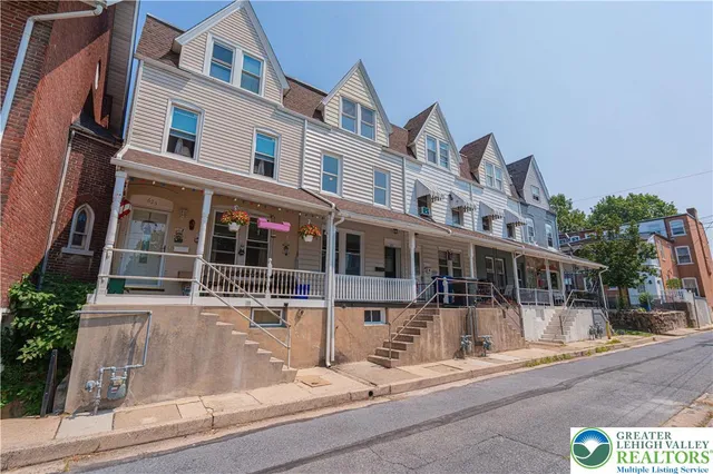 front view of a building with a garden