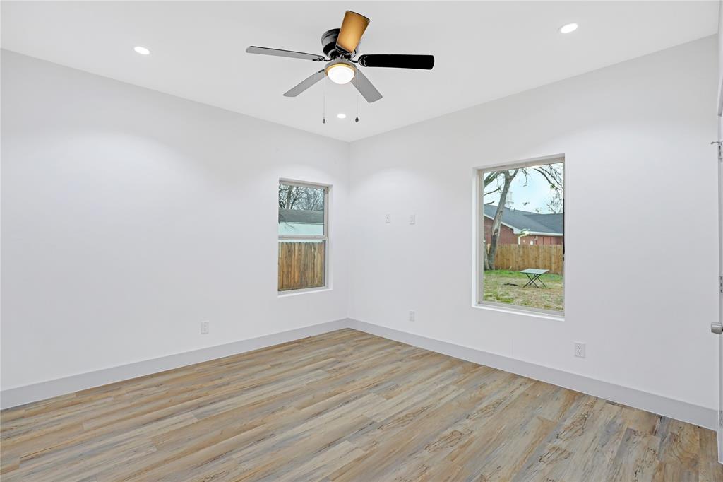 2606 Fordham Road Dallas, TX 75216 - Photo 9 of 19 Light-filled room featuring wood-finish flooring, recessed lighting, and a modern ceiling fan