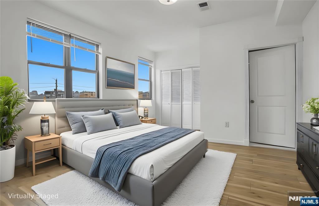 9017 Riverside Place North Bergen, NJ 07047 - Photo 15 of 27 a bedroom with a bed and a large window