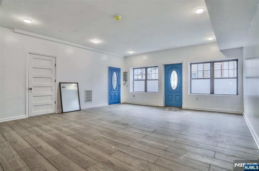 9017 Riverside Place North Bergen, NJ 07047 - Photo 4 of 27 a view of an empty room with a window and fireplace