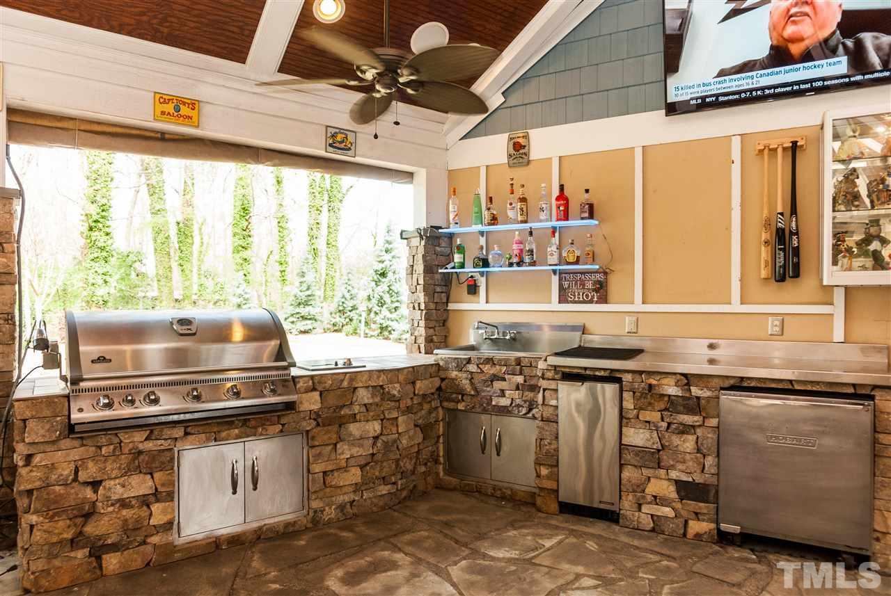 6428 Brandywine Road Raleigh, NC 27607 - Photo 22 of 25 a kitchen with a stove a sink and a microwave
