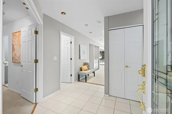 a view of a hallway with dining area and glass door