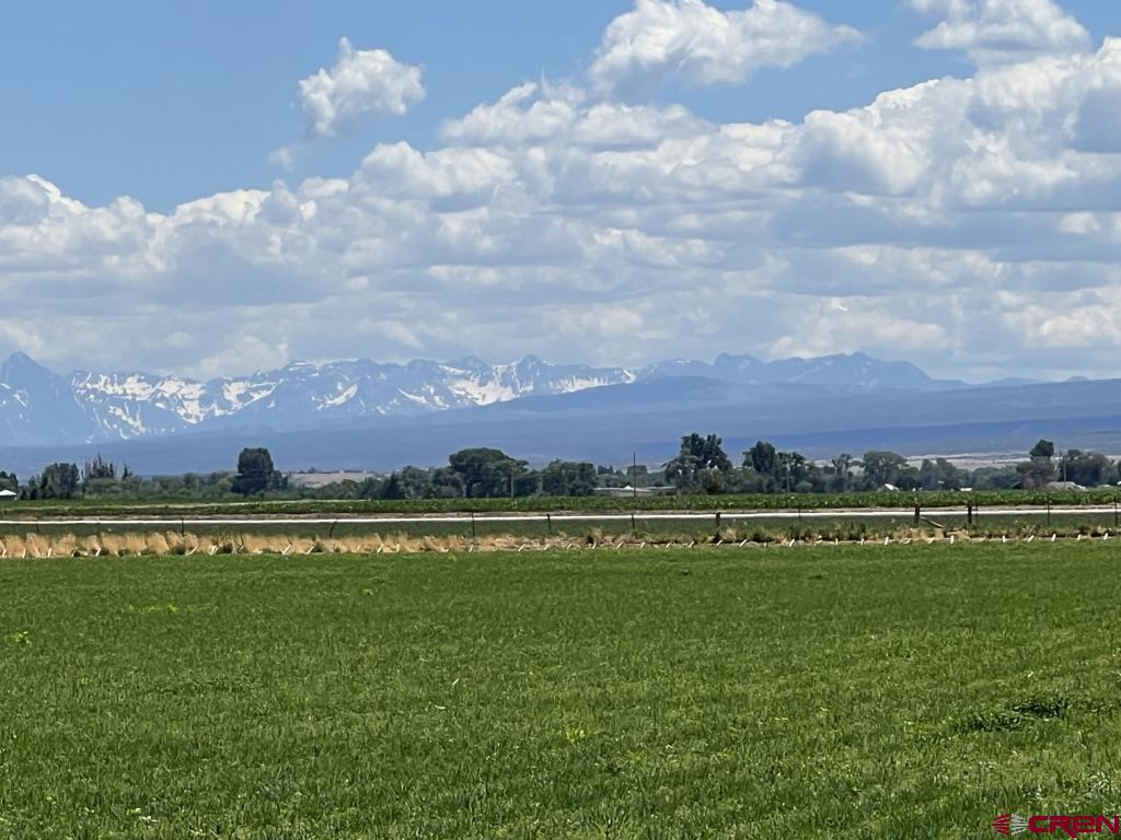 Lot 2 Banner Road Delta, CO 81425 - Photo 5 of 12 a view of a lake with a building in the background
