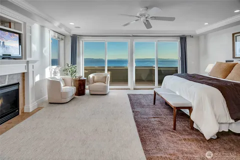 a bedroom with bed and a fireplace