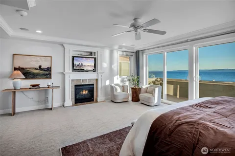 a bedroom with a bed and a lamp on desk