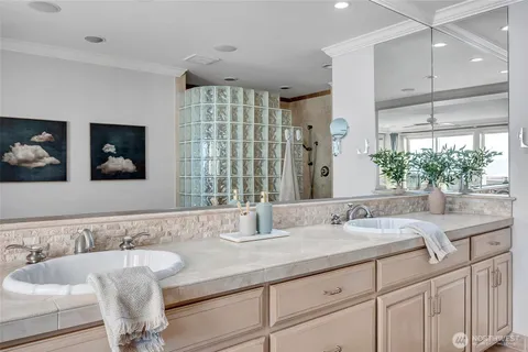 a bathroom with a bathtub and a shower