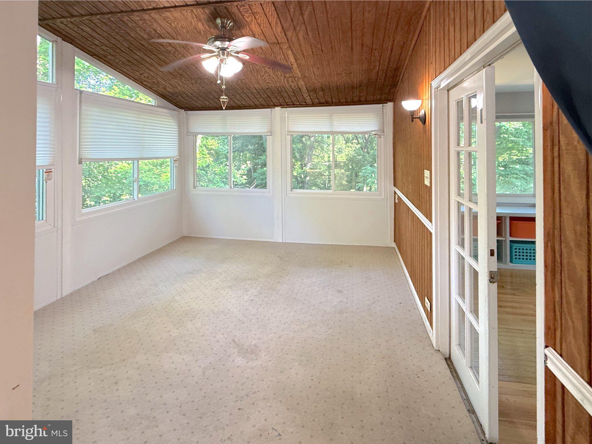 9006 Sidehill Road Ellicott City, MD 21042 - Photo 8 of 53 Bright sunroom with nature views.