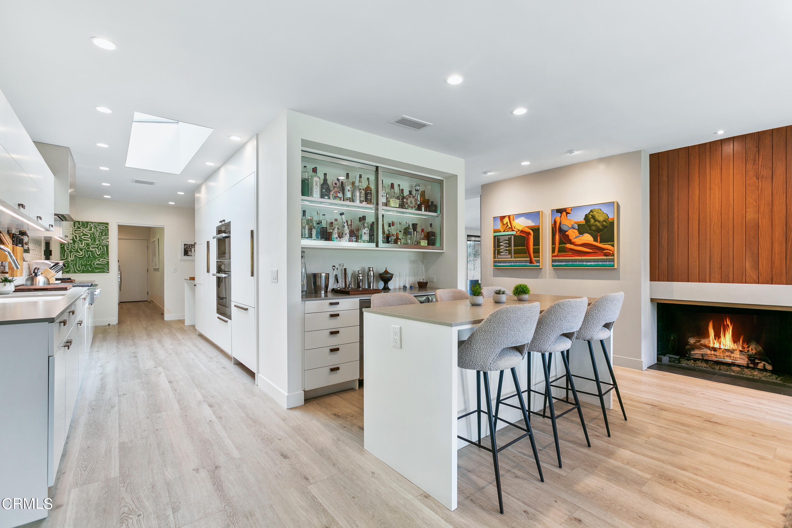 1240 Chateau Road Pasadena, CA 91105 - Photo 12 of 30 a kitchen with stainless steel appliances kitchen island granite countertop a table chairs and a refrigerator