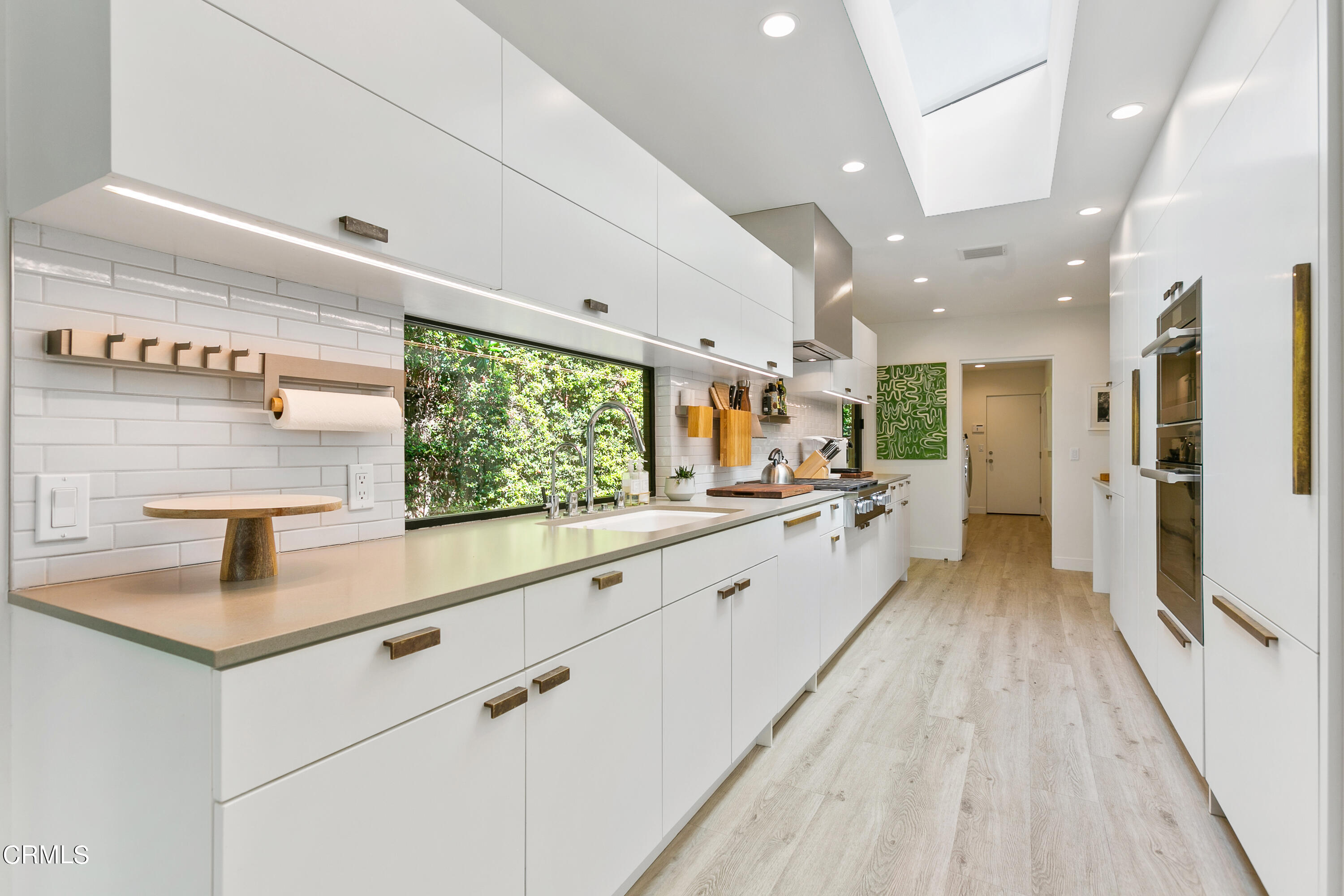 1240 Chateau Road Pasadena, CA 91105 - Photo 14 of 30 a large white kitchen with a large window