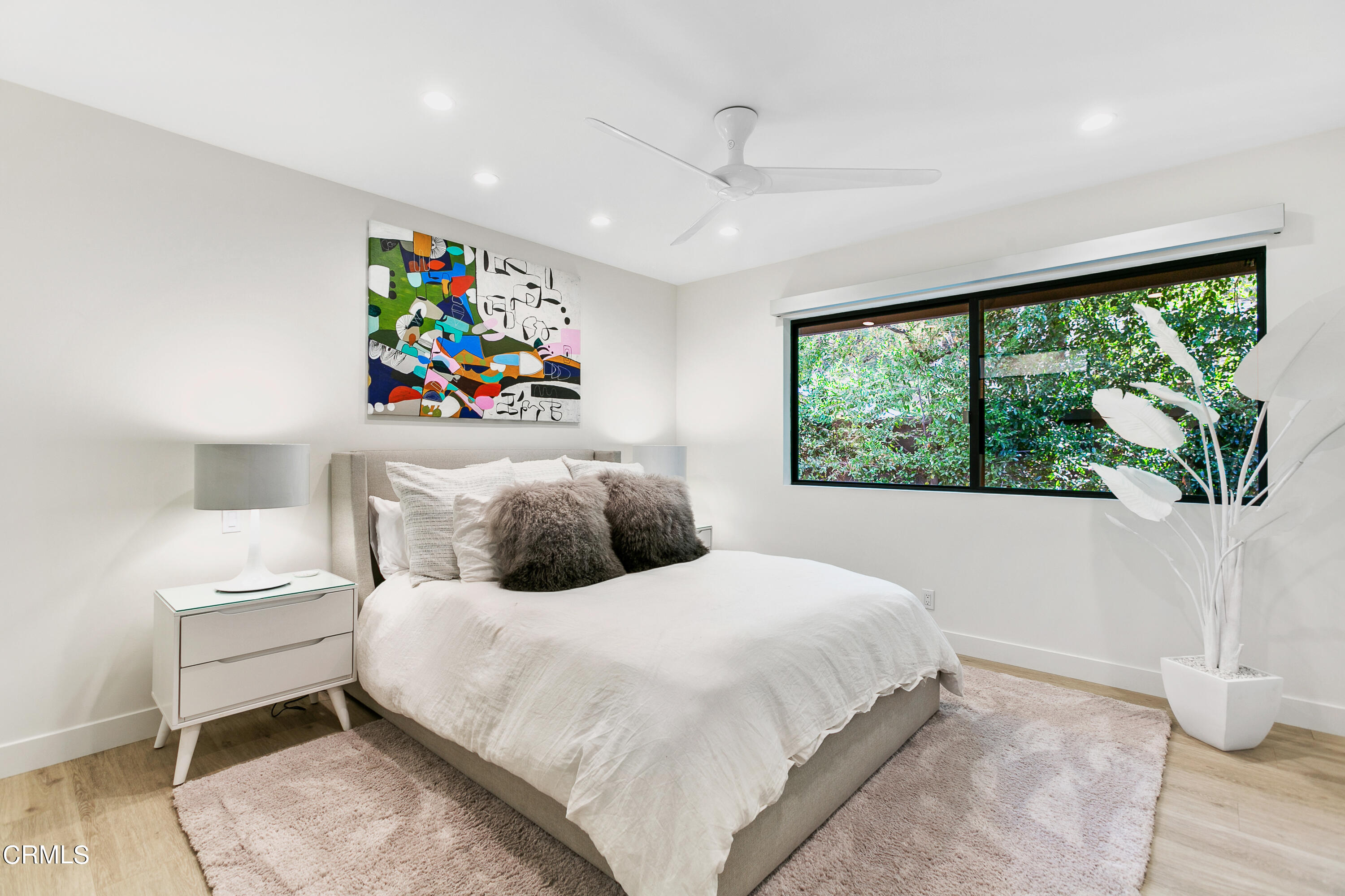 1240 Chateau Road Pasadena, CA 91105 - Photo 20 of 30 a bedroom with a bed and a painting on the wall