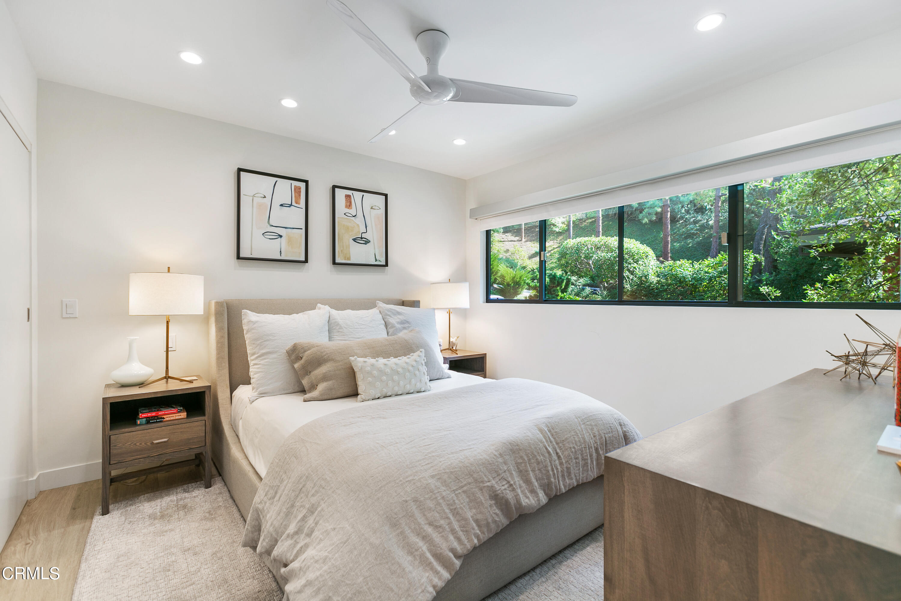 1240 Chateau Road Pasadena, CA 91105 - Photo 22 of 30 a bedroom with a large bed and a large window