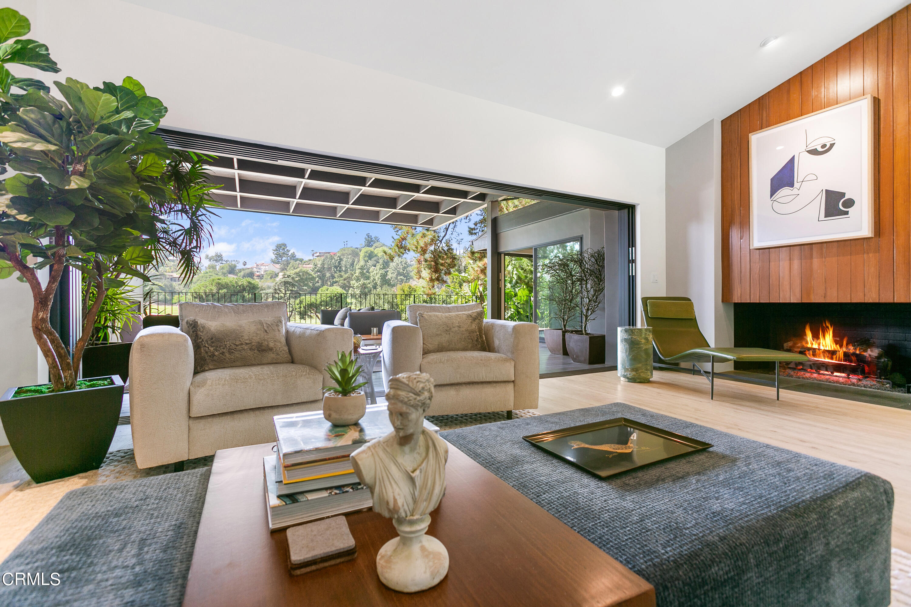 1240 Chateau Road Pasadena, CA 91105 - Photo 7 of 30 a living room with furniture and a fireplace