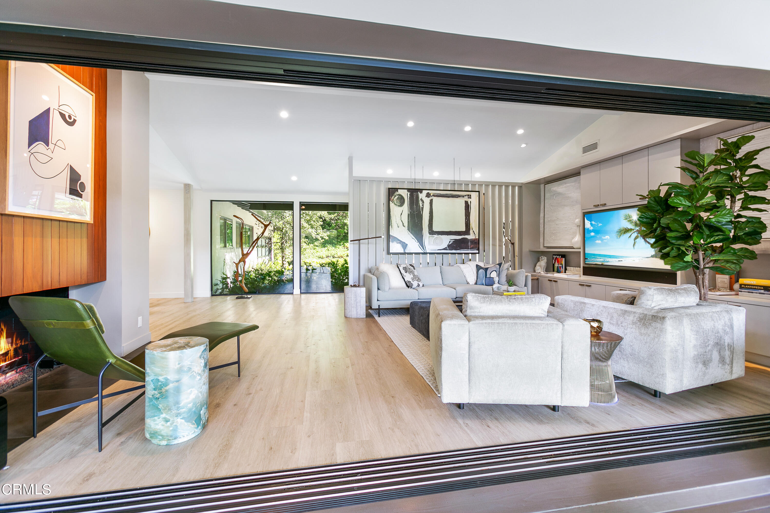 1240 Chateau Road Pasadena, CA 91105 - Photo 10 of 30 a living room with fireplace furniture and a large window