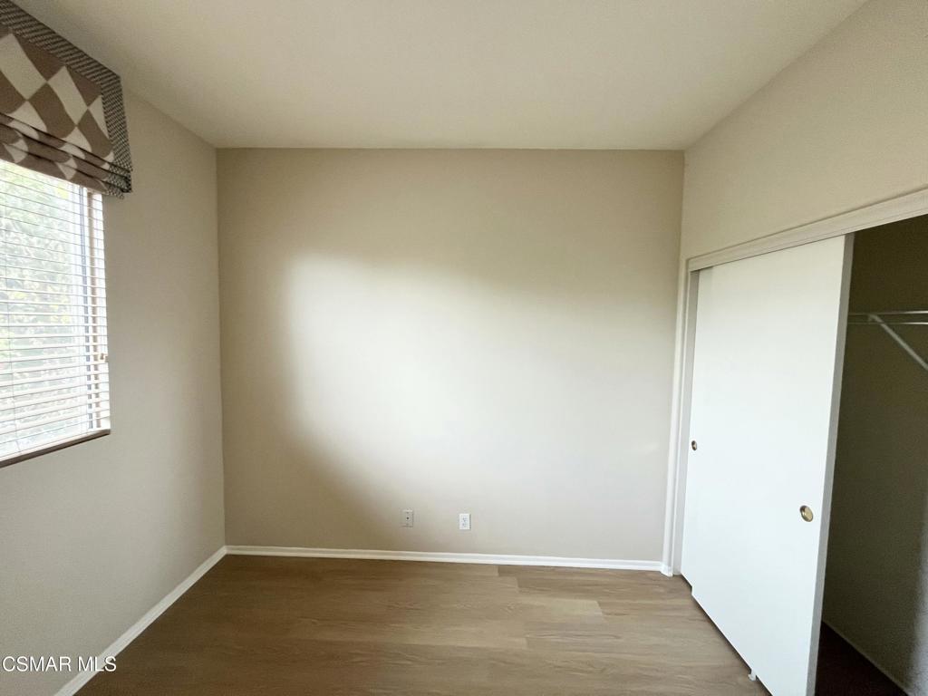 273 Springmist Lane Simi Valley, CA 93065 - Photo 11 of 14 an empty room with wooden floor and windows