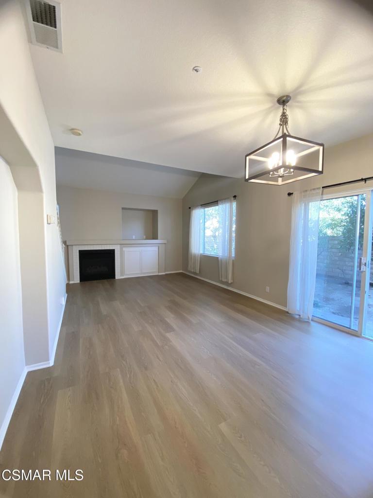 273 Springmist Lane Simi Valley, CA 93065 - Photo 2 of 14 an empty room with wooden floor and windows