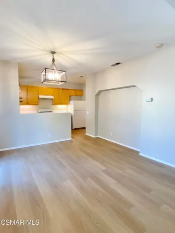 a view of a kitchen with a dishwasher and a cabinets