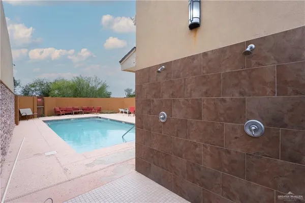 a view of a bathroom with a tub and window