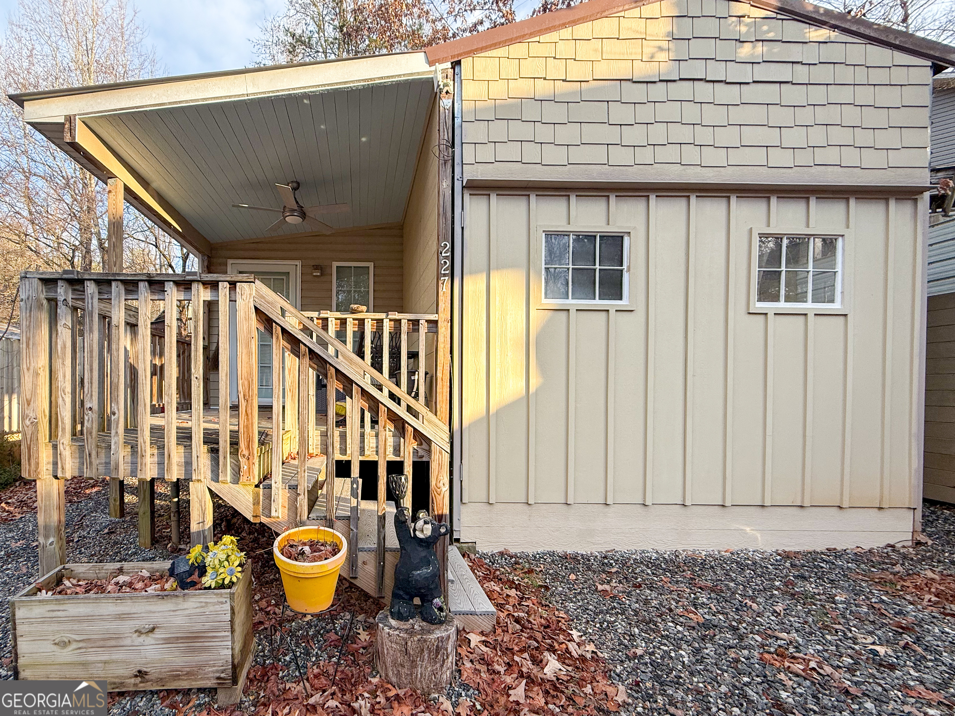 227 Canyon Pass Cleveland, GA 30528 - Photo 3 of 15 a view of a brick house with wooden fence