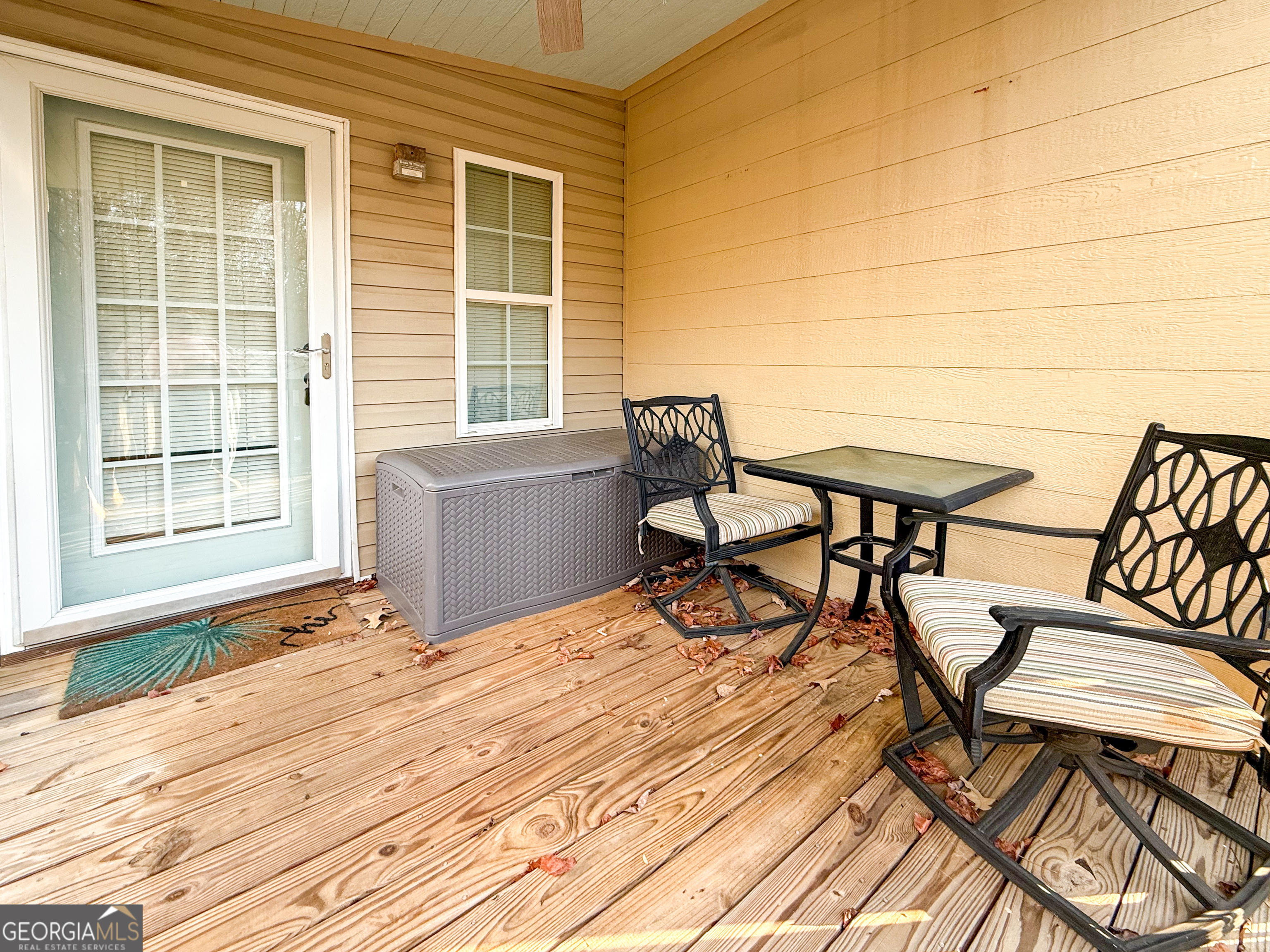 227 Canyon Pass Cleveland, GA 30528 - Photo 4 of 15 a view of a roof deck with wooden floor and furniture