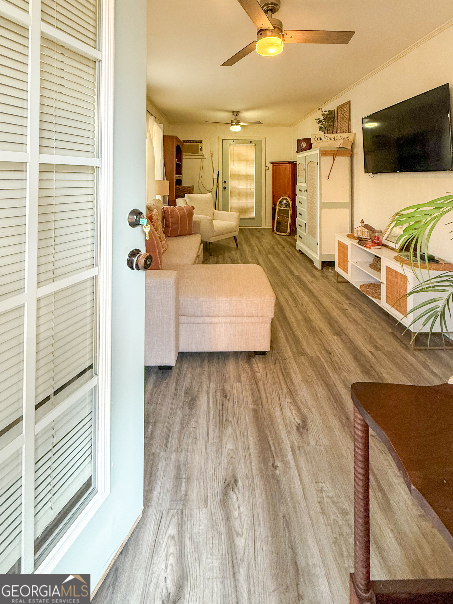 227 Canyon Pass Cleveland, GA 30528 - Photo 5 of 15 a living room with furniture and a flat screen tv