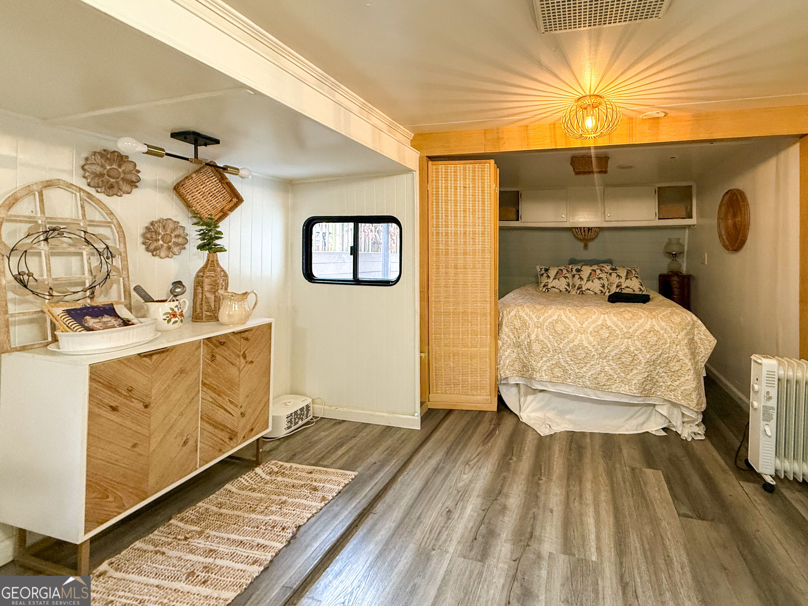 227 Canyon Pass Cleveland, GA 30528 - Photo 8 of 15 a bedroom with a bed and a mirror