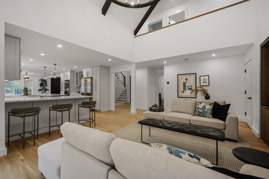 54 Spywood Road Sherborn, MA 01770 - Photo 14 of 41 a living room with furniture and kitchen view