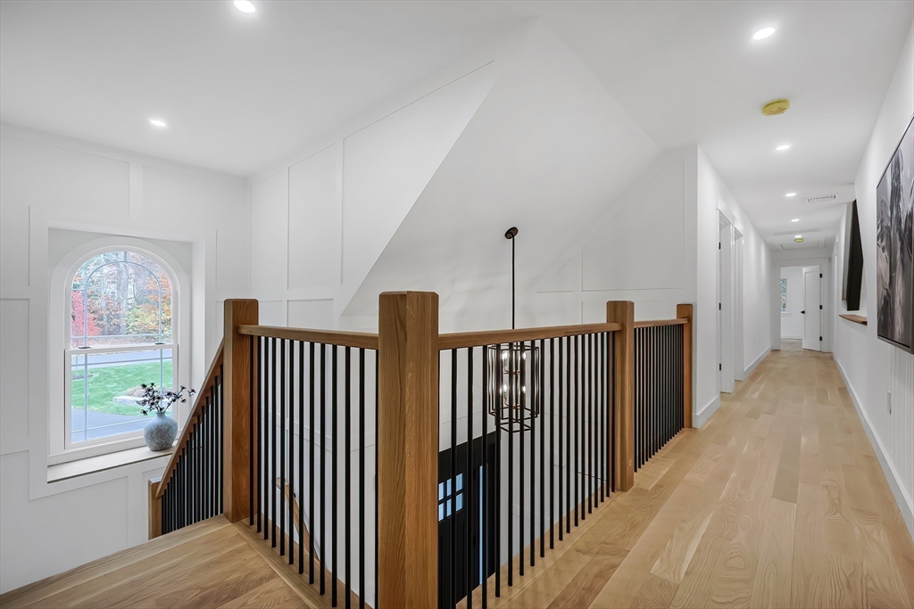 54 Spywood Road Sherborn, MA 01770 - Photo 18 of 41 a view of a hallway with windows