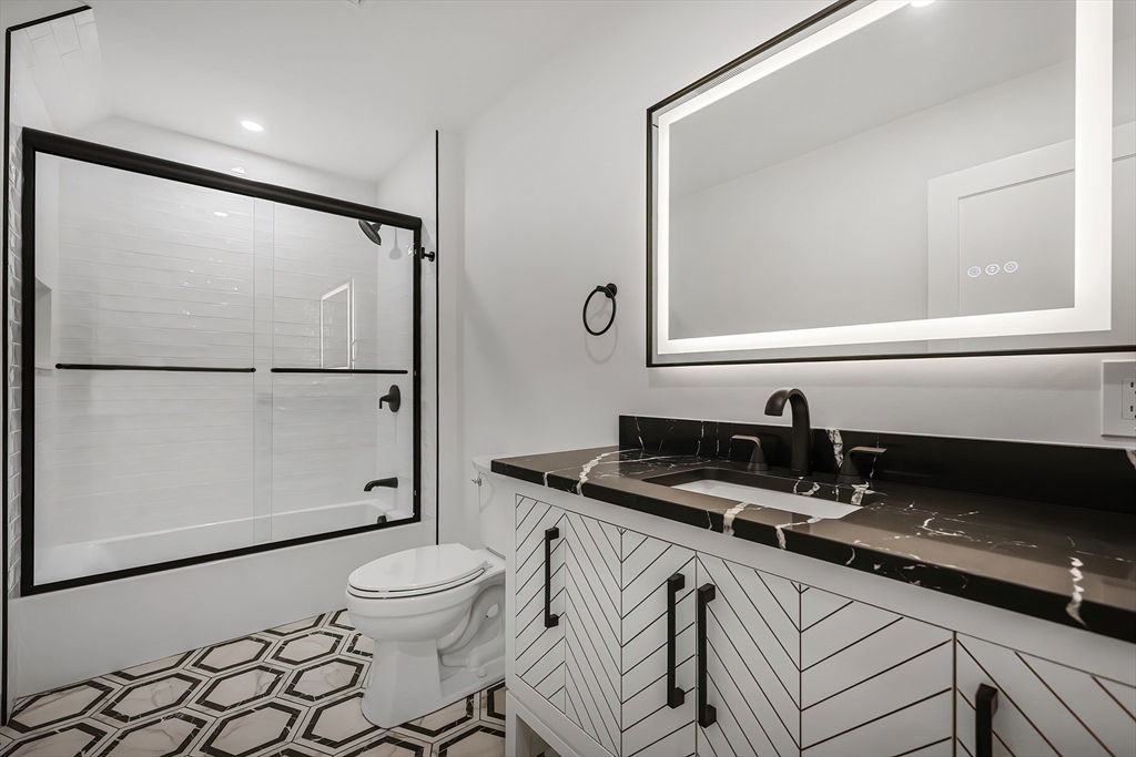 54 Spywood Road Sherborn, MA 01770 - Photo 30 of 41 a bathroom with a granite countertop sink mirror vanity and toilet