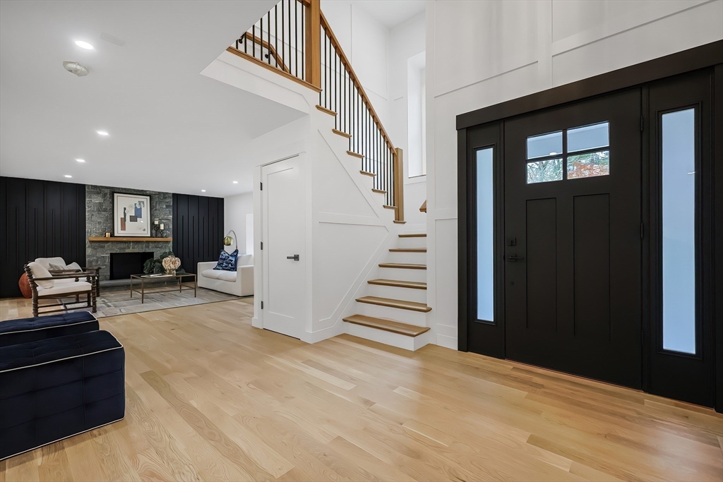 54 Spywood Road Sherborn, MA 01770 - Photo 3 of 41 a view of a livingroom with furniture and stairs
