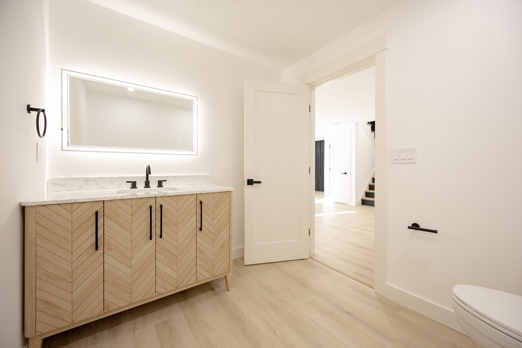 54 Spywood Road Sherborn, MA 01770 - Photo 31 of 41 a bathroom with a sink a toilet and shower