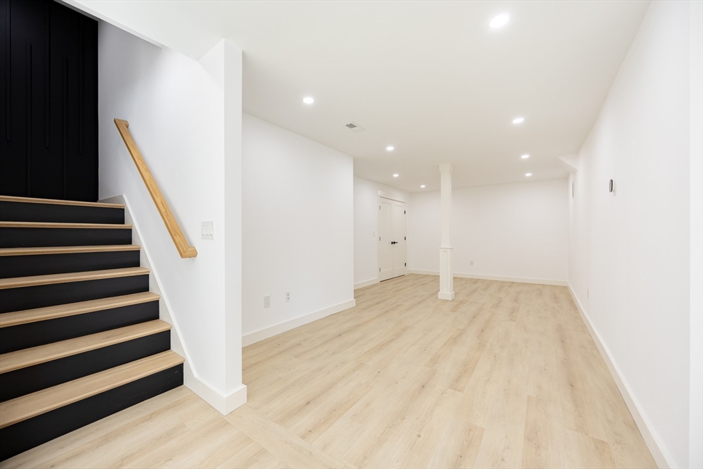 54 Spywood Road Sherborn, MA 01770 - Photo 32 of 41 wooden floor in an empty room with stairs