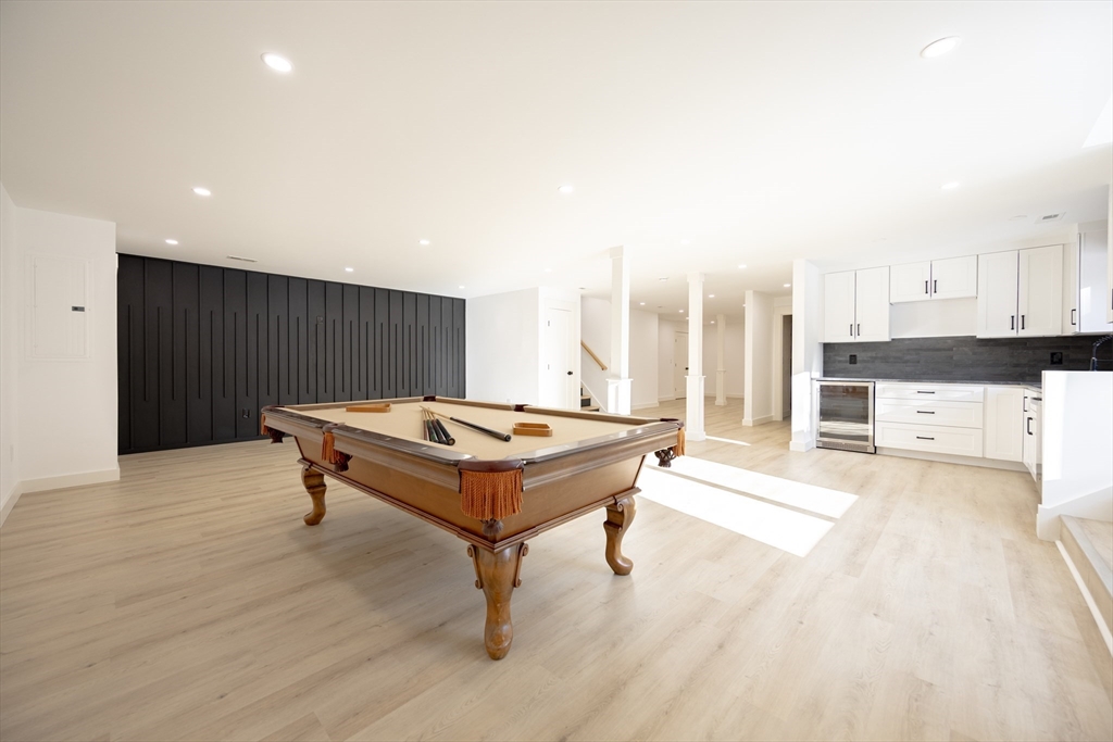 54 Spywood Road Sherborn, MA 01770 - Photo 34 of 41 a living room with a table and chairs