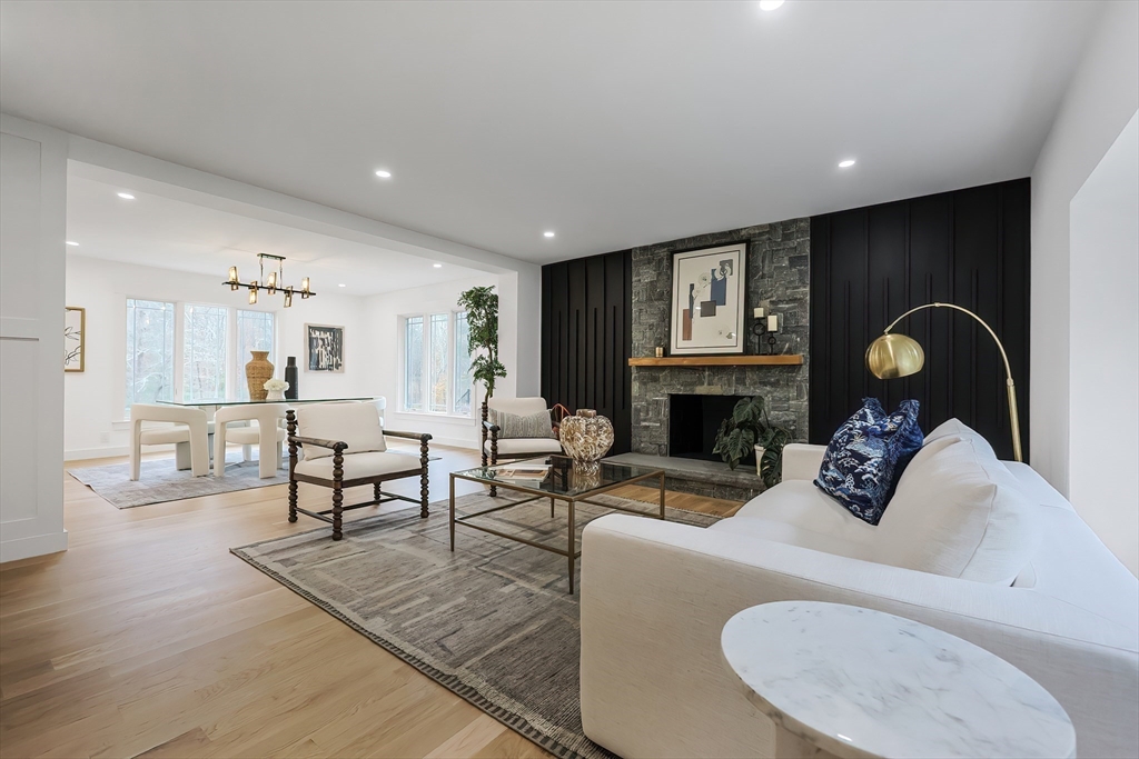 54 Spywood Road Sherborn, MA 01770 - Photo 5 of 41 a living room with furniture a fireplace and kitchen view
