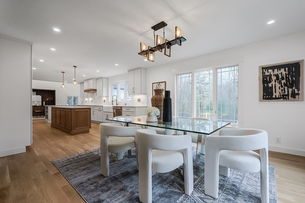 54 Spywood Road Sherborn, MA 01770 - Photo 7 of 41 a room with stainless steel appliances kitchen island granite countertop a sink and cabinets