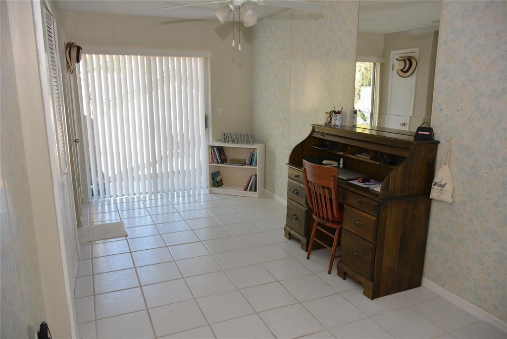 308 Tangerine Street Altamonte Springs, FL 32701 - Photo 30 of 58 Fourth bedroom, off the kitchen, with tile floors, laundry closet and continental sink could serve as a craft/hobby room with access to the garage