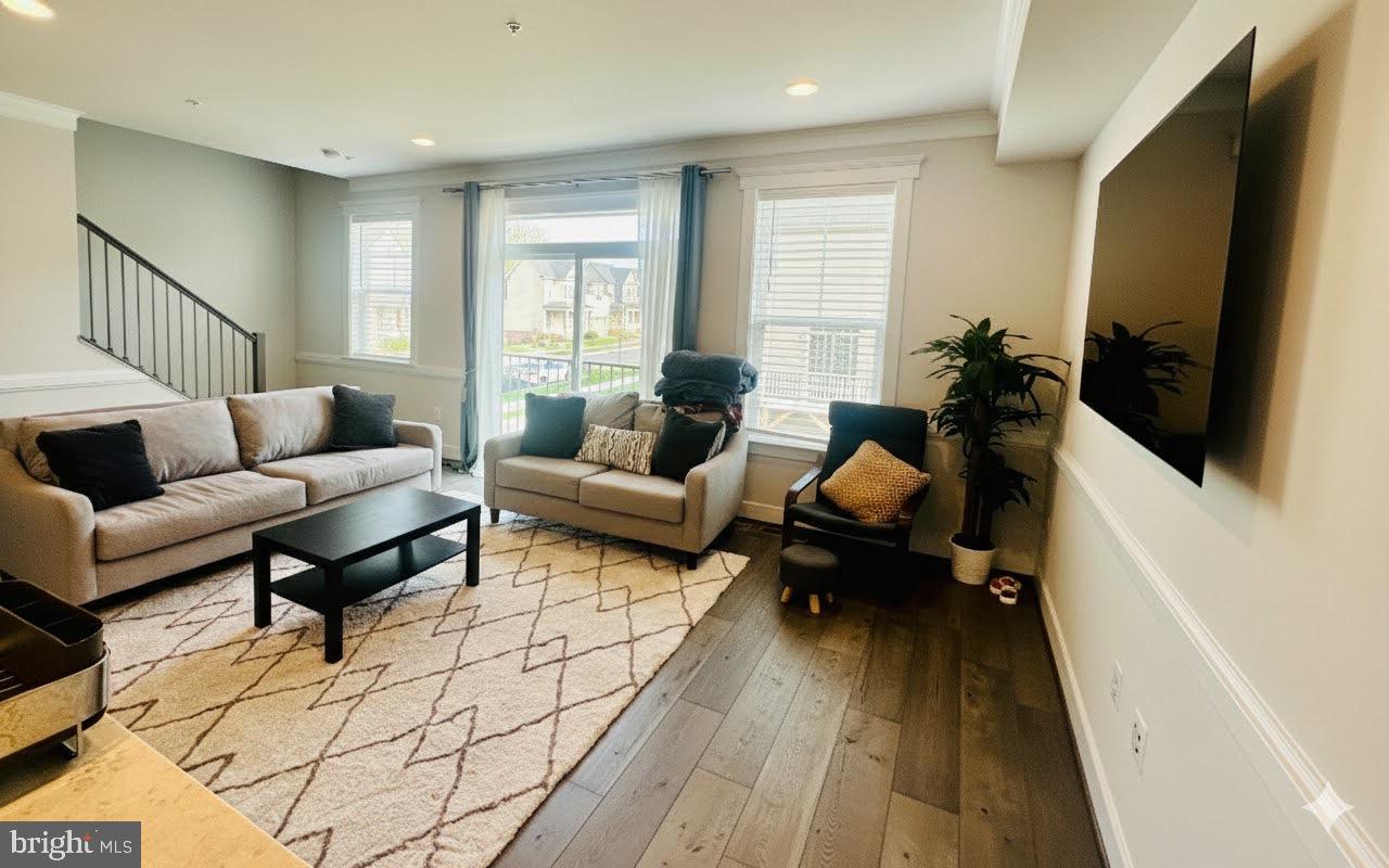 3400 Landing Way Silver Spring, MD 20906 - Photo 11 of 32 a living room with furniture wooden floor and a flat screen tv
