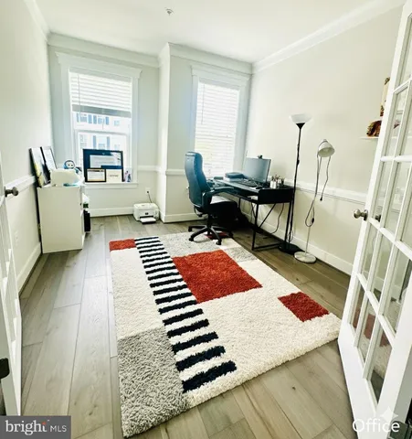 a living room with a rug and a couch