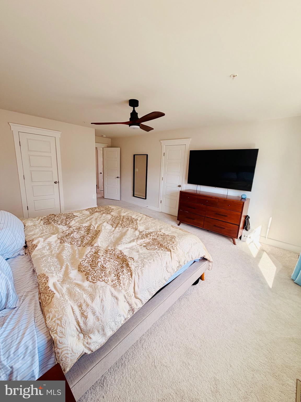 3400 Landing Way Silver Spring, MD 20906 - Photo 15 of 32 a bedroom with a bed and a flat screen tv