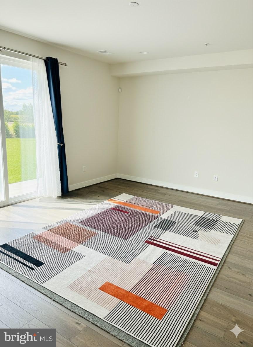3400 Landing Way Silver Spring, MD 20906 - Photo 25 of 32 a view of a room with wooden floor and a window
