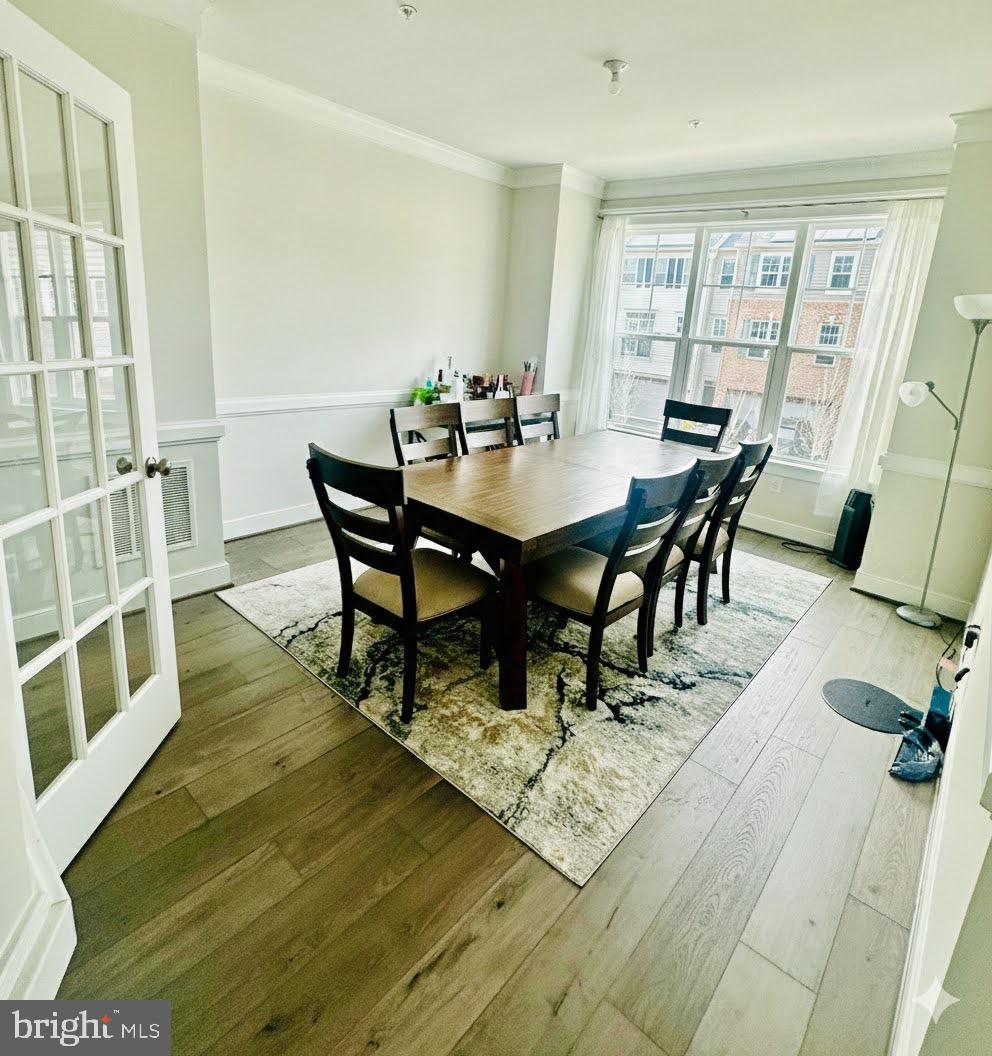 3400 Landing Way Silver Spring, MD 20906 - Photo 7 of 32 a view of a dining room with furniture and wooden floor