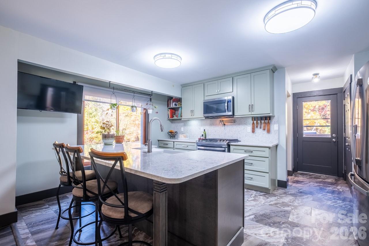 240 Eldon Lane Salisbury, NC 28144 - Photo 15 of 41 a kitchen with a table chairs refrigerator and cabinets