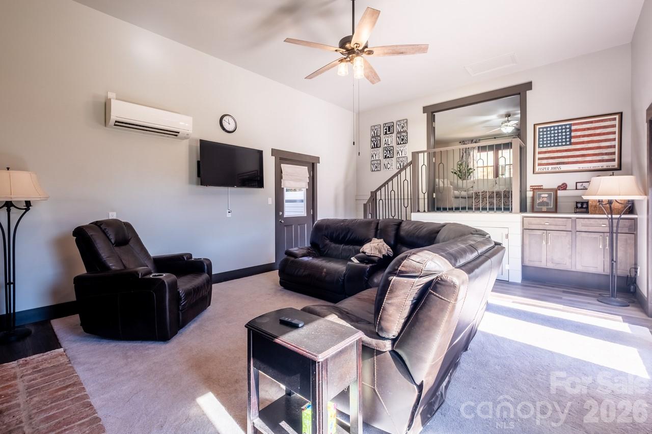 240 Eldon Lane Salisbury, NC 28144 - Photo 22 of 41 a living room with furniture a flat screen tv and a window
