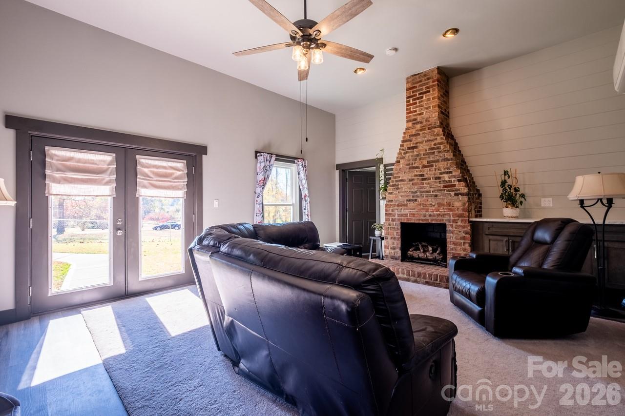 240 Eldon Lane Salisbury, NC 28144 - Photo 23 of 41 a living room with furniture and a fireplace