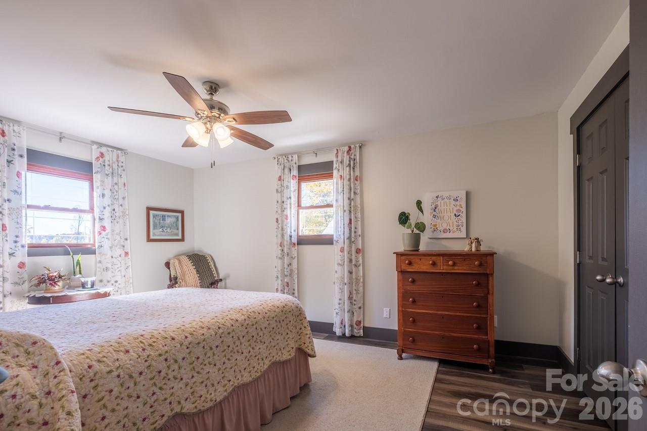 240 Eldon Lane Salisbury, NC 28144 - Photo 28 of 41 a bedroom with a bed and a chandelier