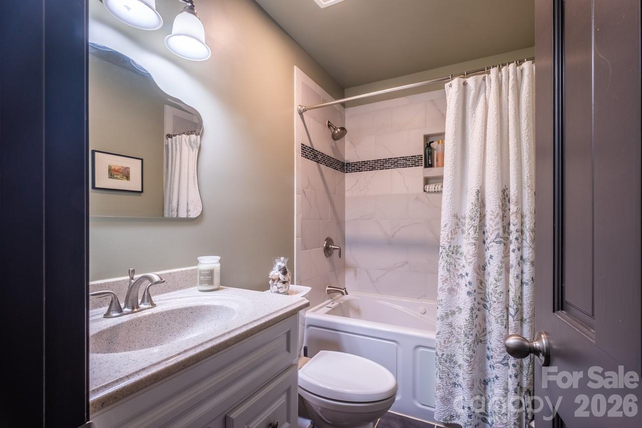 240 Eldon Lane Salisbury, NC 28144 - Photo 33 of 41 a bathroom with a granite countertop bathtub shower sink vanity mirror and toilet